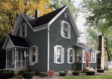 grey house metal roof|dark grey brick house.